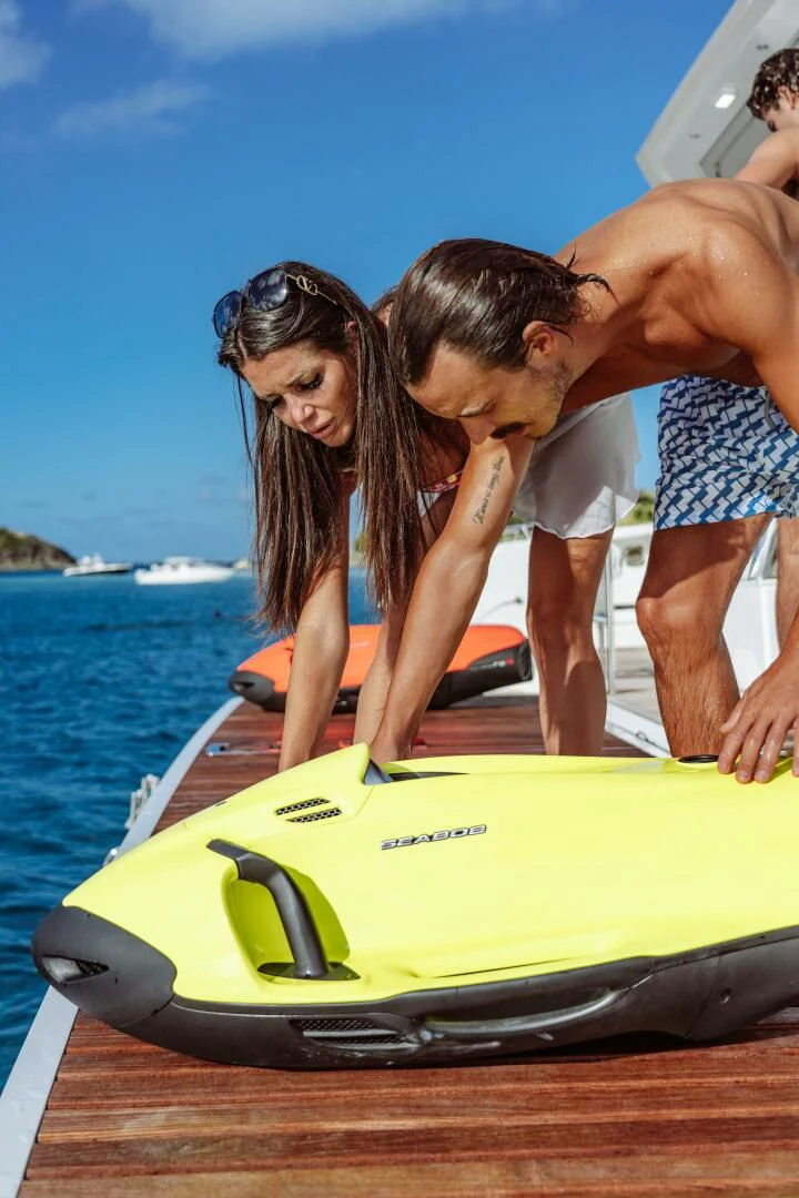 a man and woman kissing on a boat aboard OCEANUS Yacht for Sale
