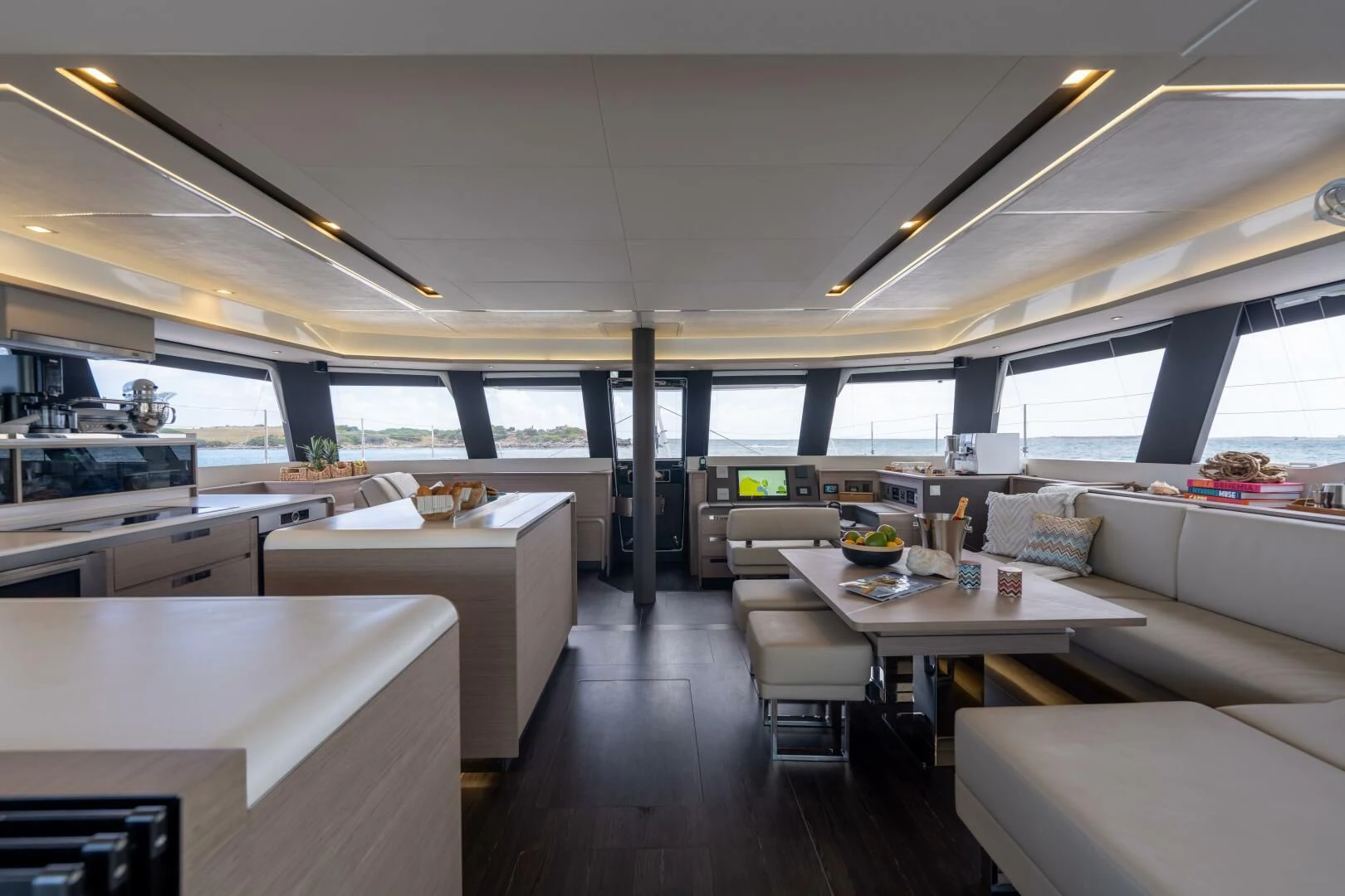 a room with a table and chairs aboard OCEANUS Yacht for Sale
