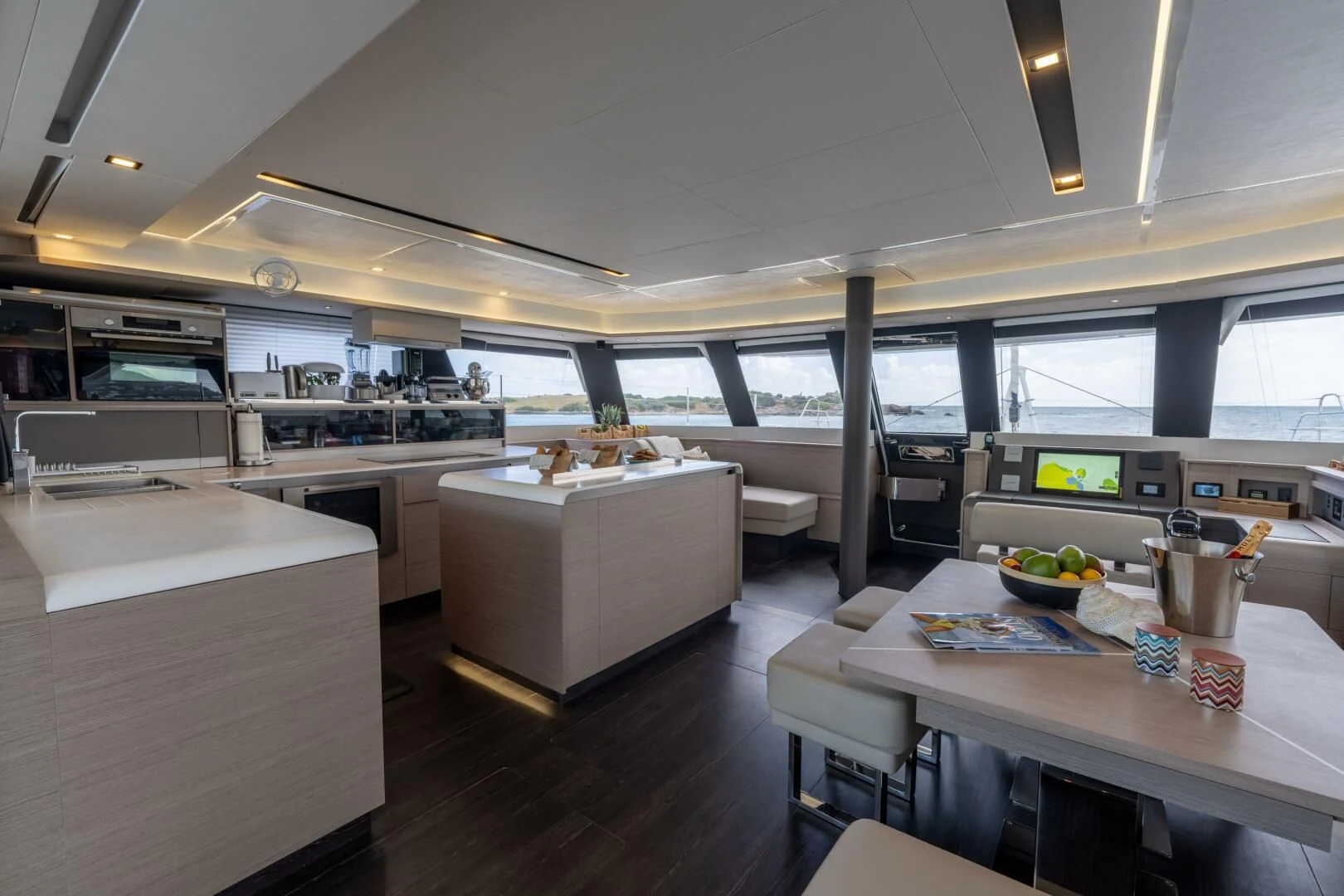 a large room with a table and chairs aboard OCEANUS Yacht for Sale