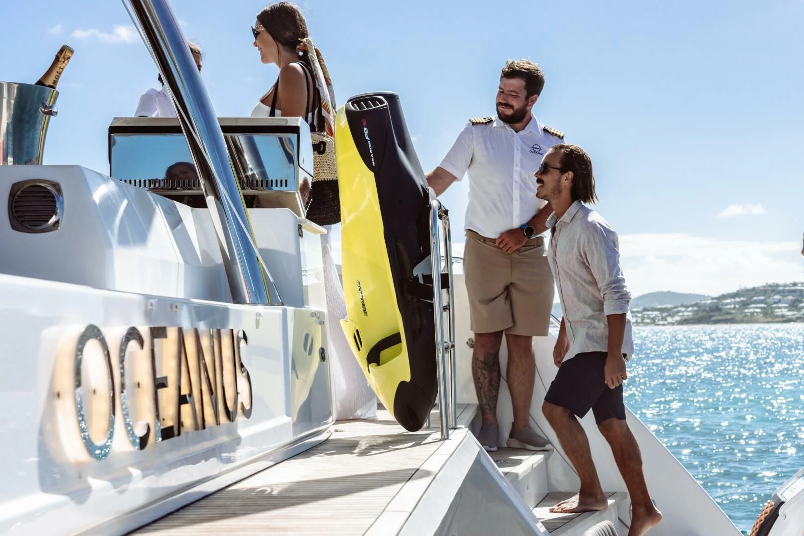 a group of people on a boat aboard OCEANUS Yacht for Sale