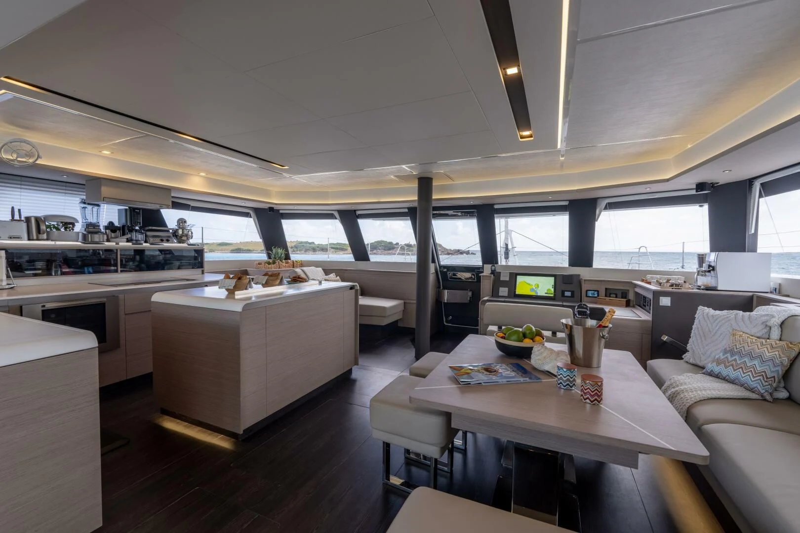 a large open kitchen and dining area aboard OCEANUS Yacht for Sale