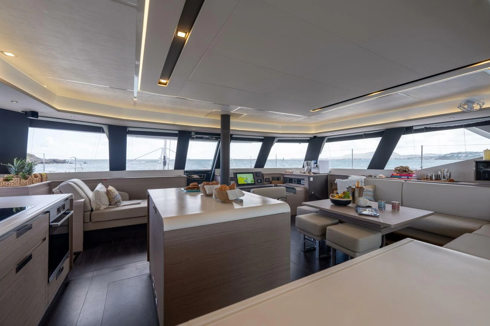 a room with a bed and a table aboard OCEANUS Yacht for Sale
