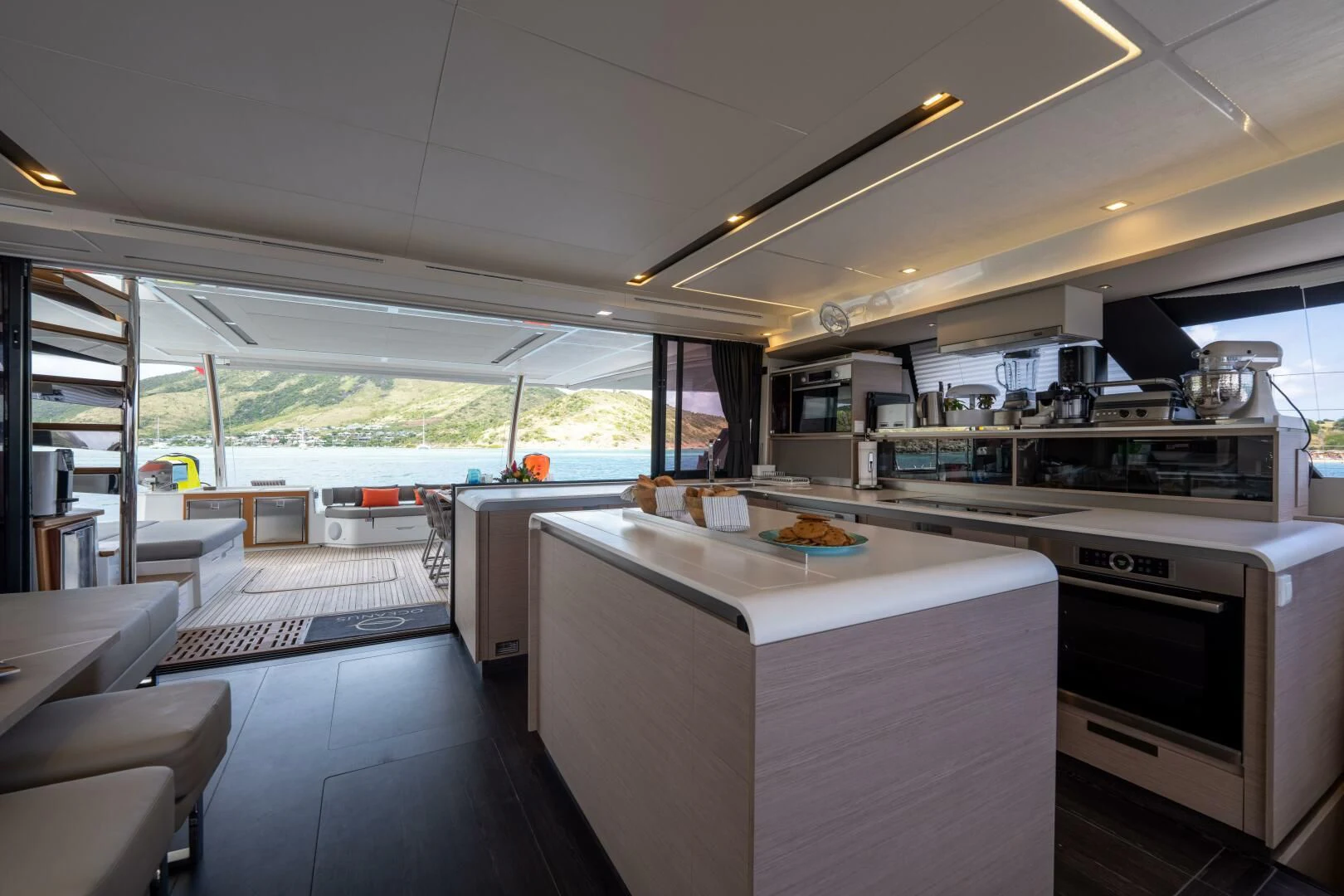 a kitchen with a large window aboard OCEANUS Yacht for Sale