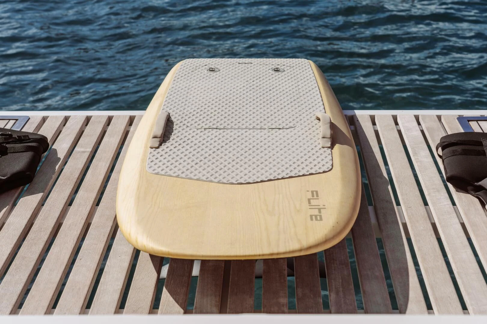 a white towel on a wooden dock aboard OCEANUS Yacht for Sale