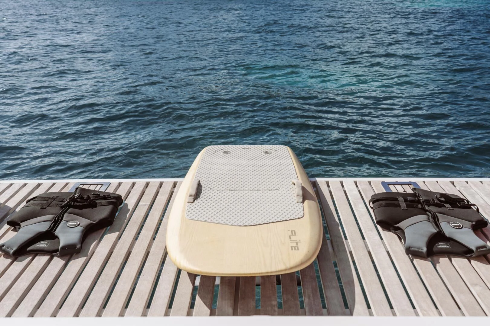 a chair on a deck overlooking the ocean aboard OCEANUS Yacht for Sale