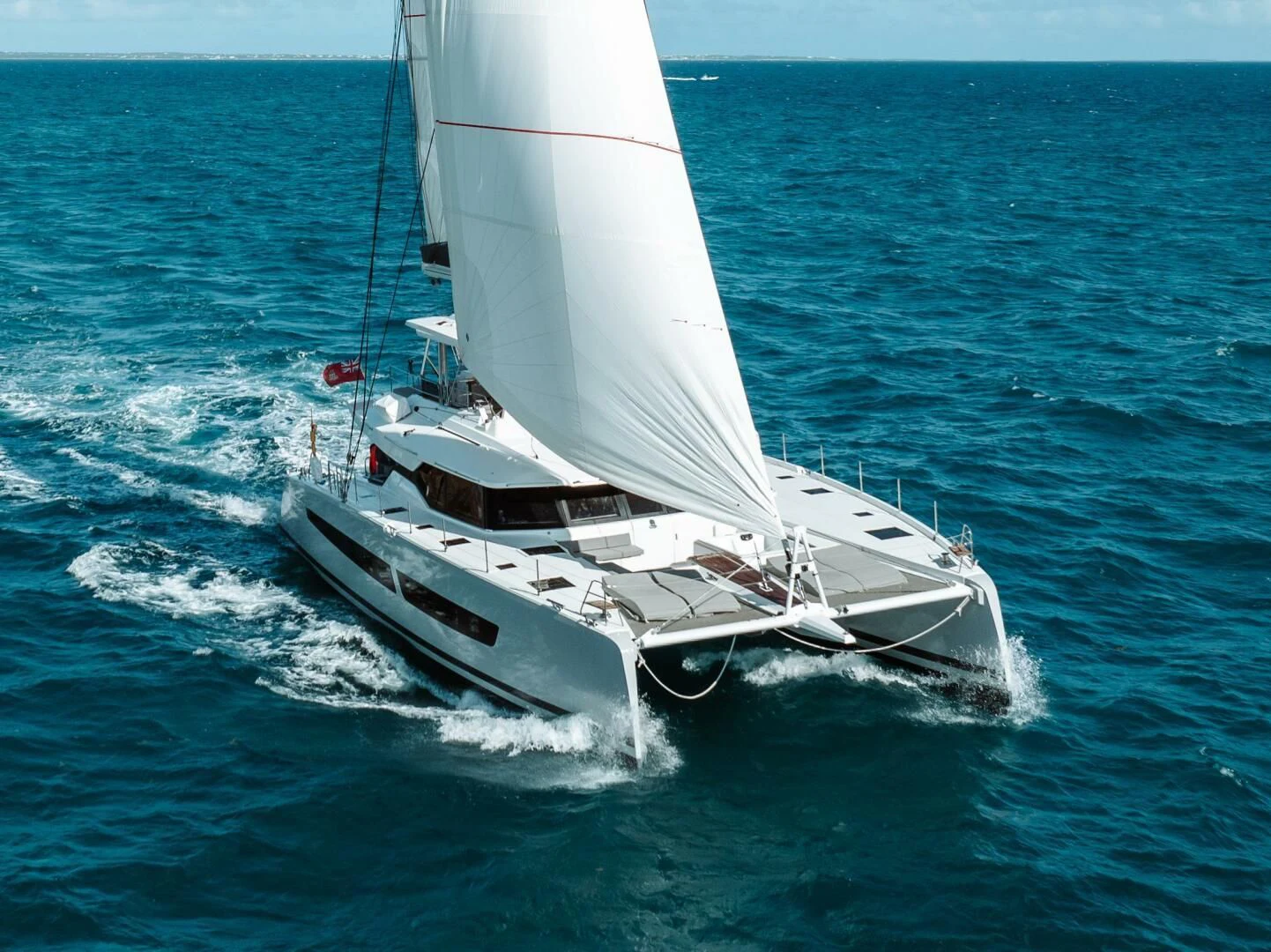 a white boat on the water aboard OCEANUS Yacht for Sale