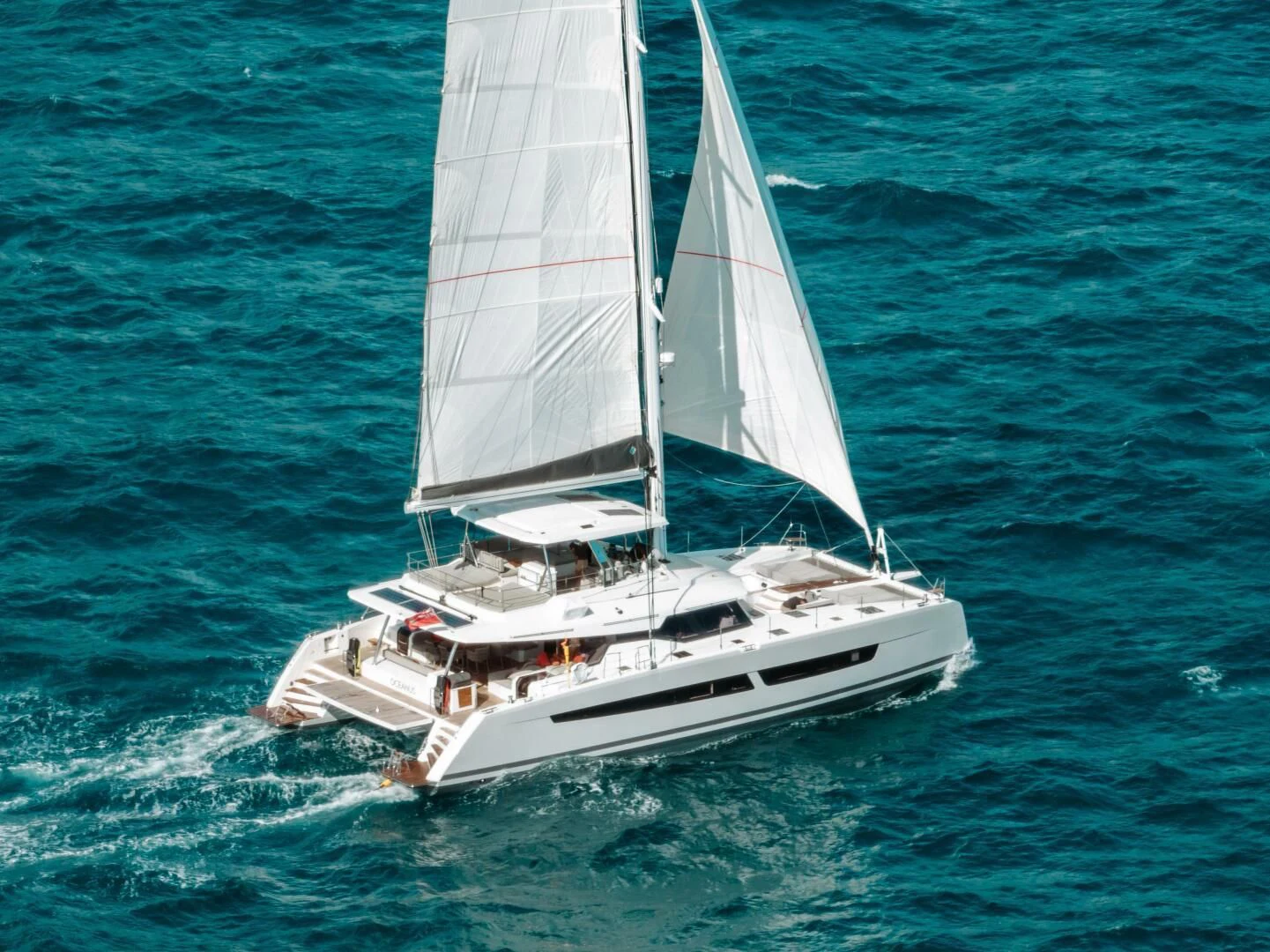 a sailboat on the water aboard OCEANUS Yacht for Sale