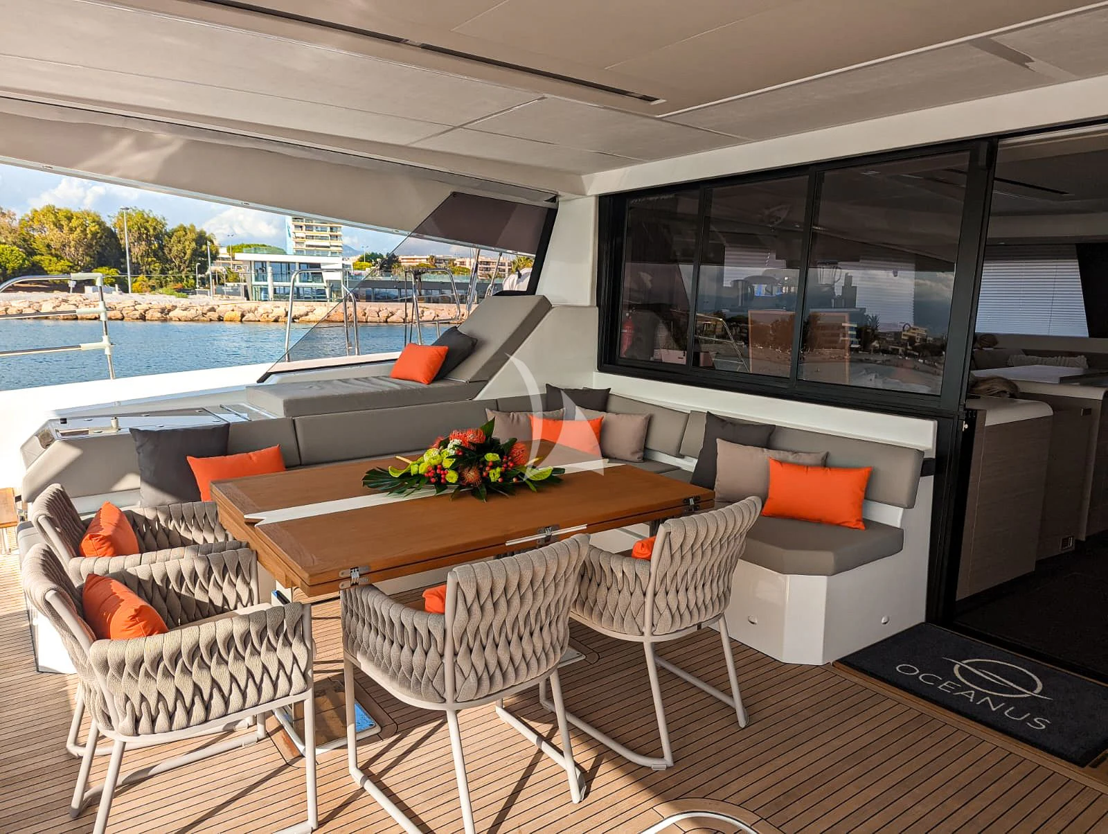 a room with a table and chairs aboard OCEANUS Yacht for Sale