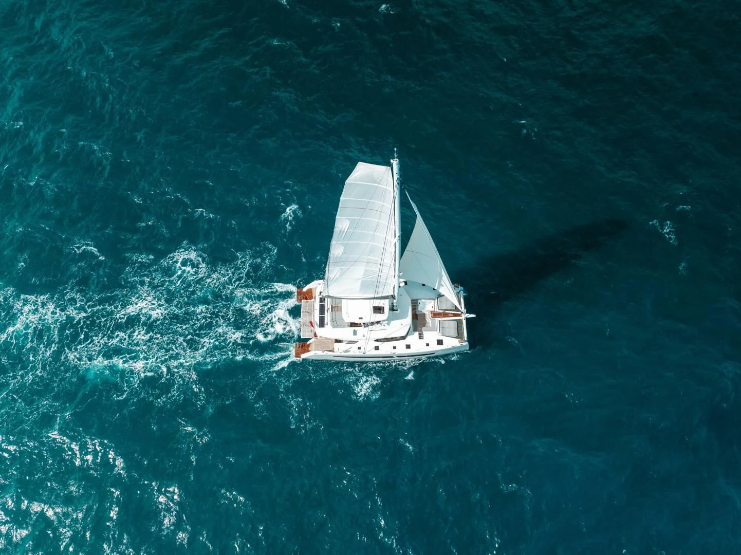 a boat sailing on the sea aboard OCEANUS Yacht for Sale