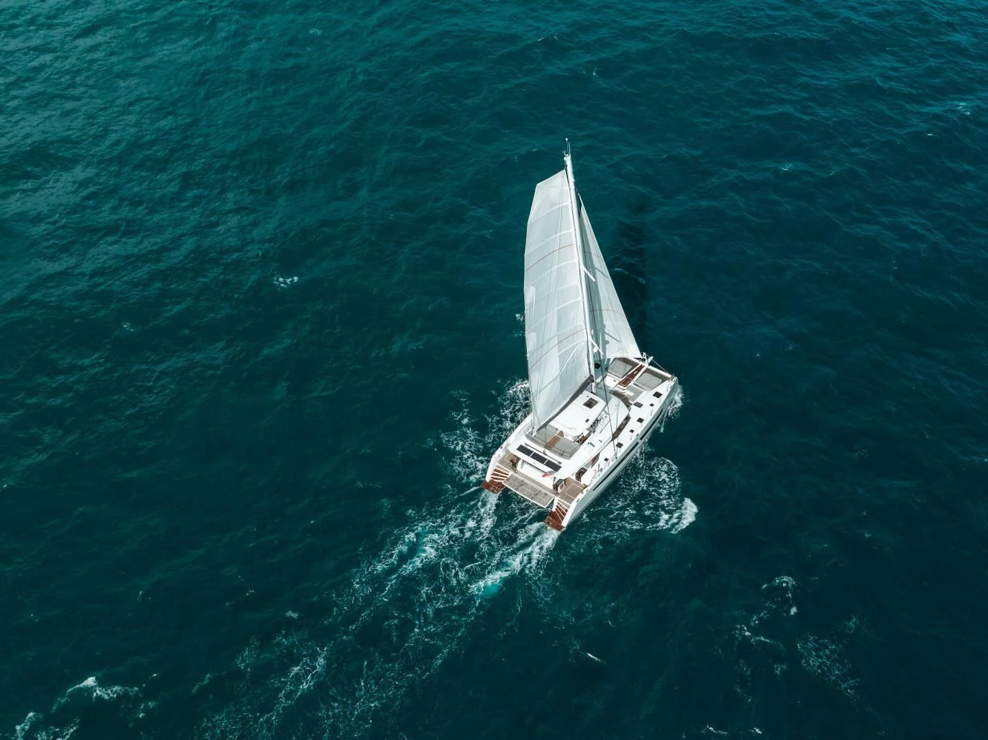 a boat in the ocean aboard OCEANUS Yacht for Sale