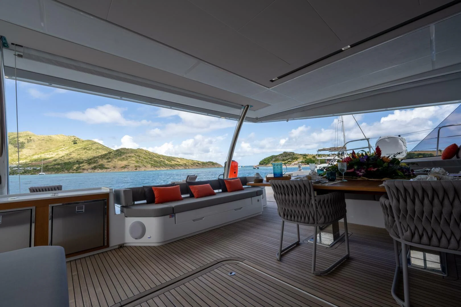 a large room with a couch and a table and chairs aboard OCEANUS Yacht for Sale