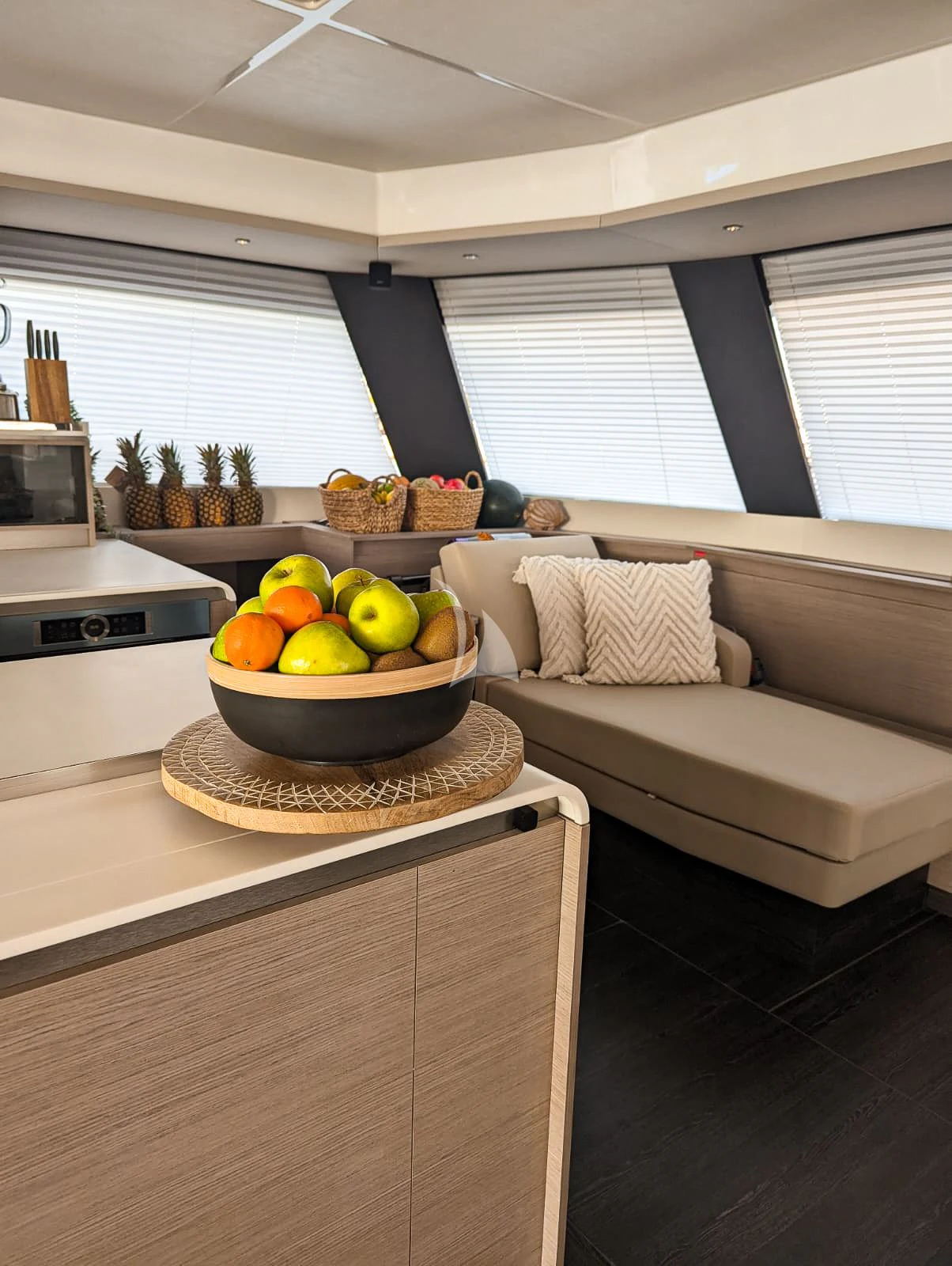 a kitchen with a bowl of fruit aboard OCEANUS Yacht for Sale