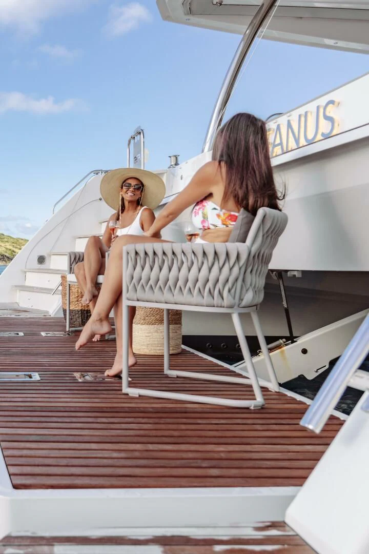two women sitting on a boat aboard OCEANUS Yacht for Sale