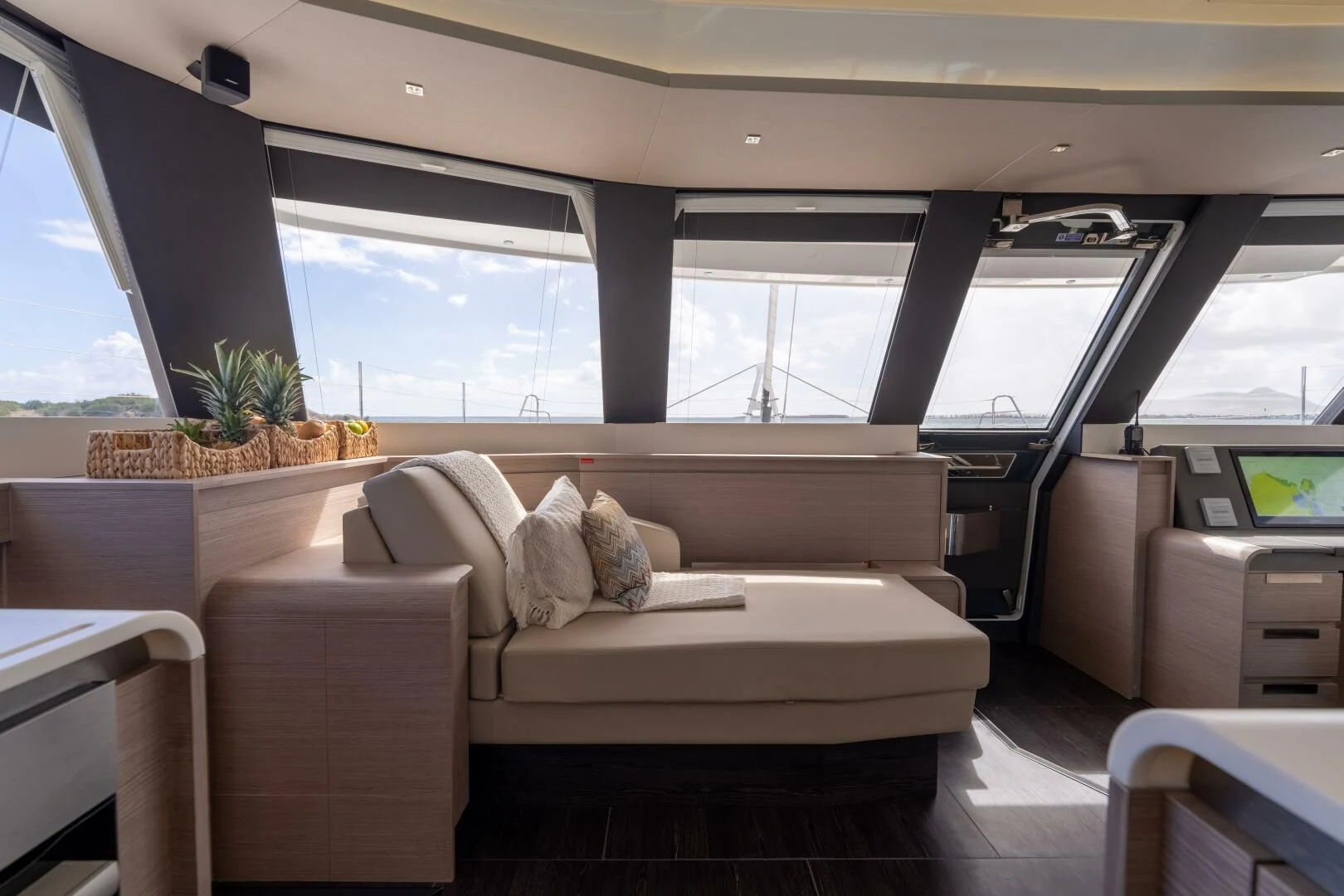 a room with a couch and a table aboard OCEANUS Yacht for Sale