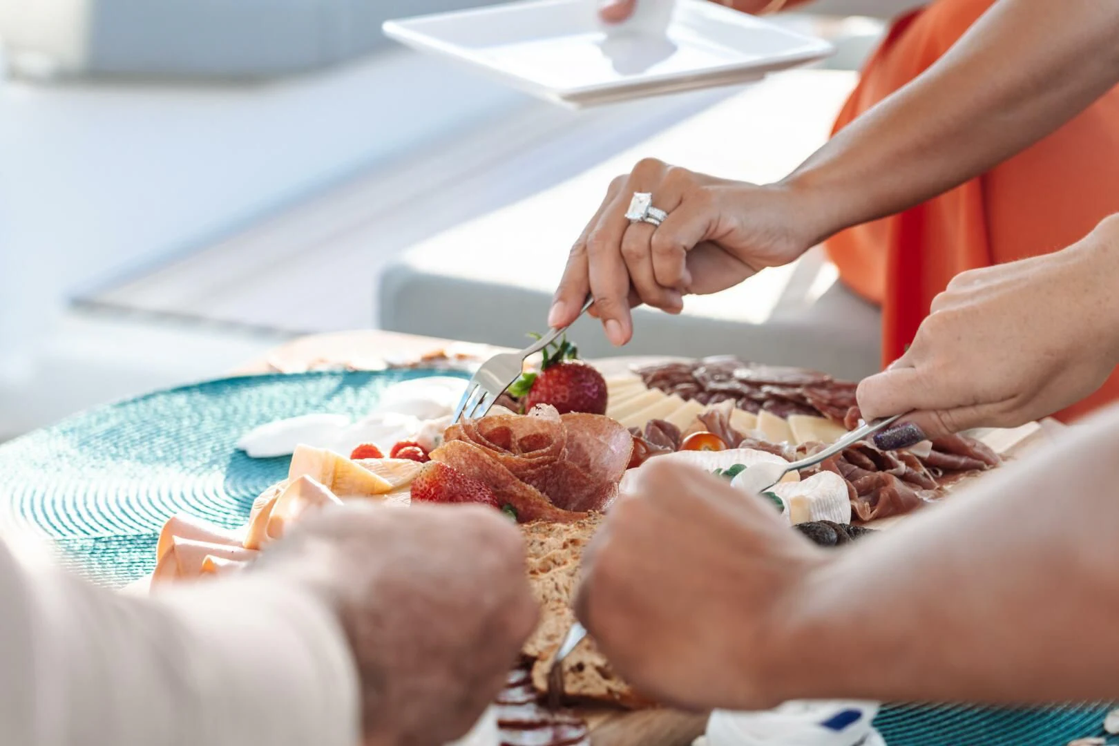 a person cutting a piece of meat aboard OCEANUS Yacht for Sale