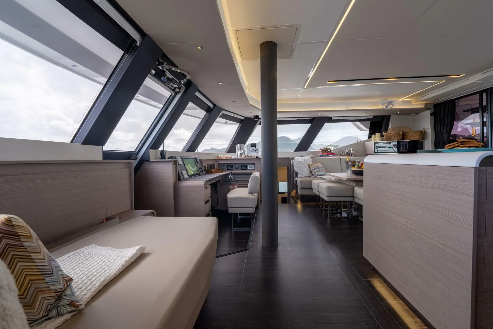 a room with a couch and a table aboard OCEANUS Yacht for Sale
