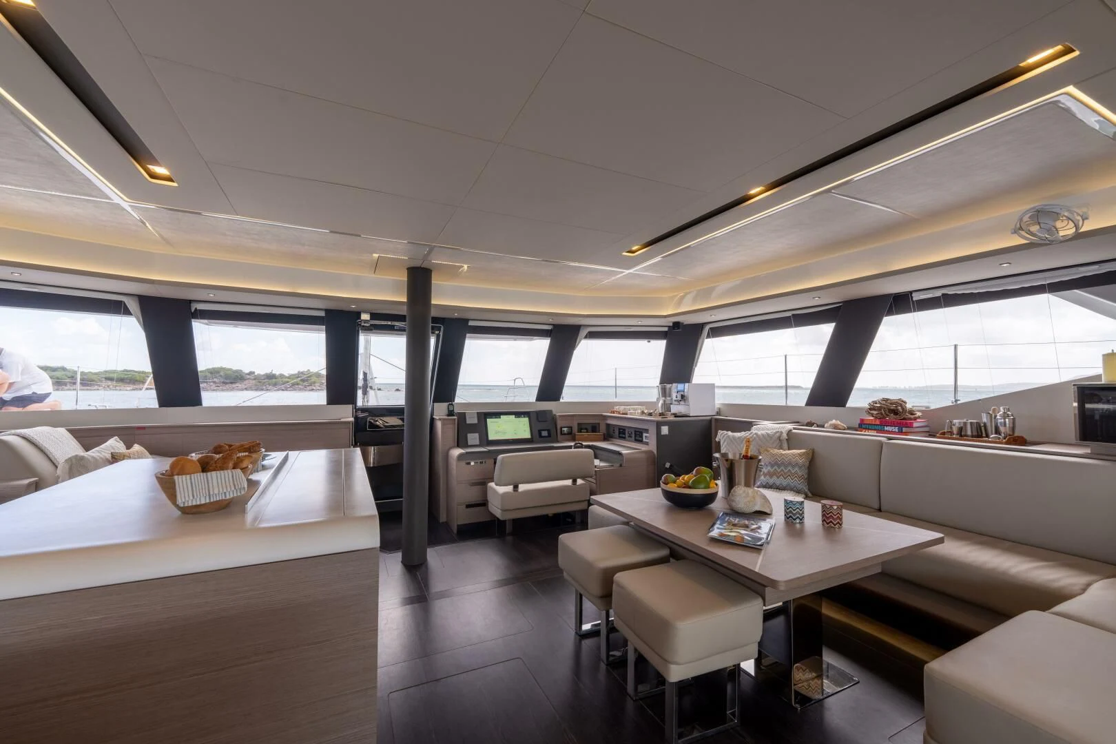a room with a table and chairs aboard OCEANUS Yacht for Sale