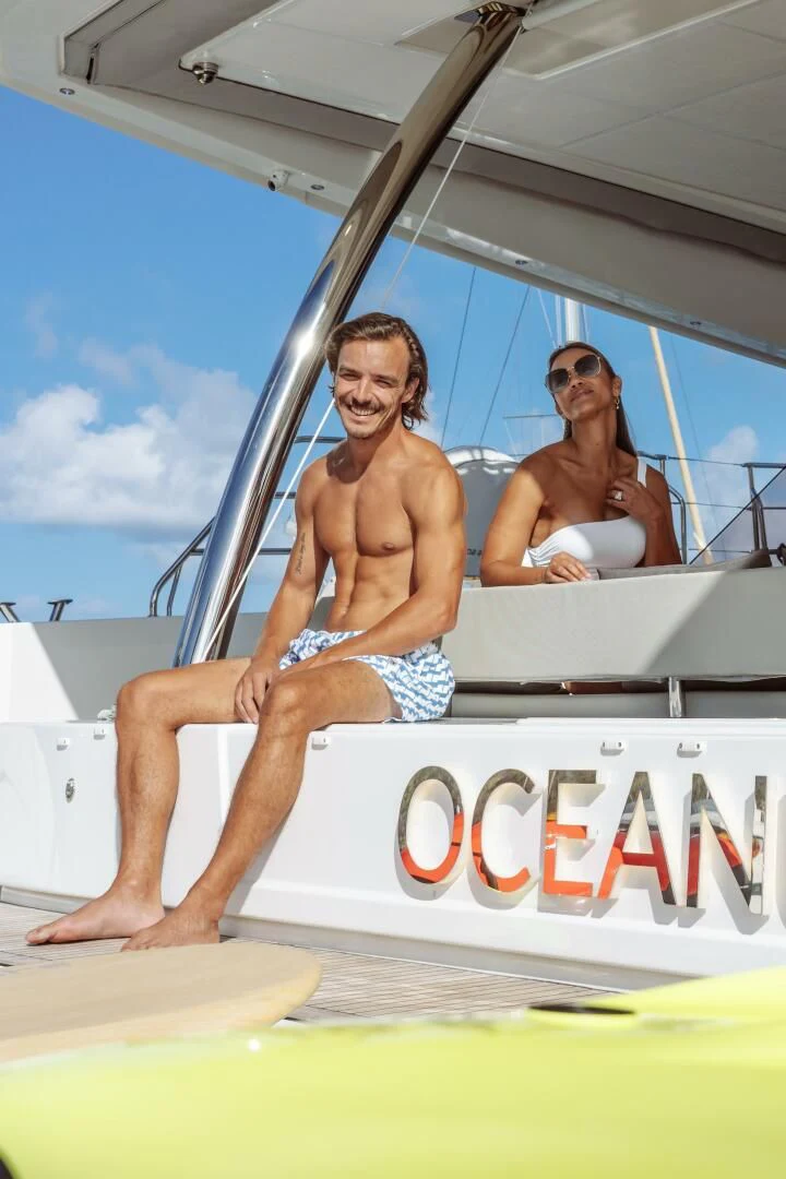 a couple of men sitting on a boat aboard OCEANUS Yacht for Sale