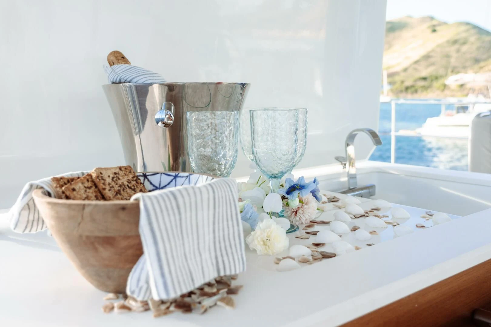 a table with a glass and a bowl of food on it aboard OCEANUS Yacht for Sale