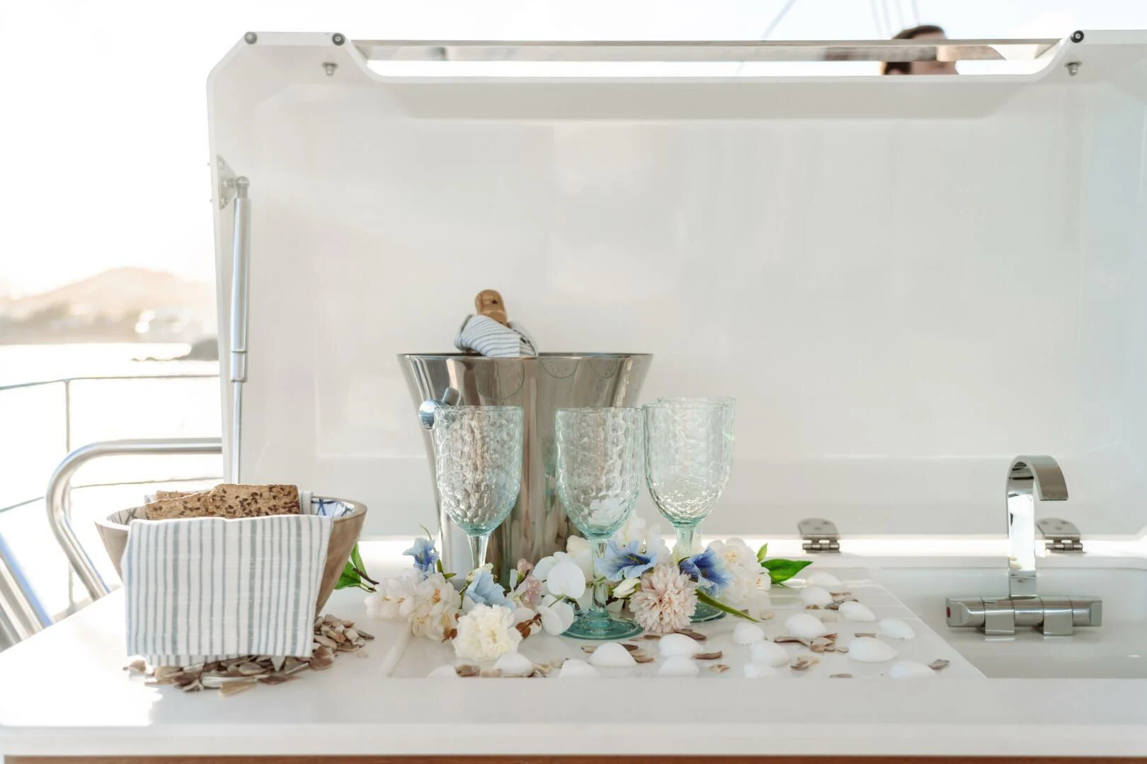 a table with a basket of flowers aboard OCEANUS Yacht for Sale