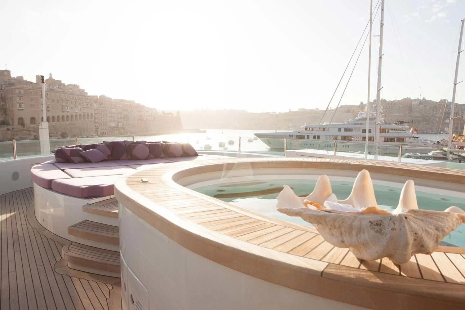 a window with a view of a city and boats in the water aboard ST DAVID Yacht for Sale