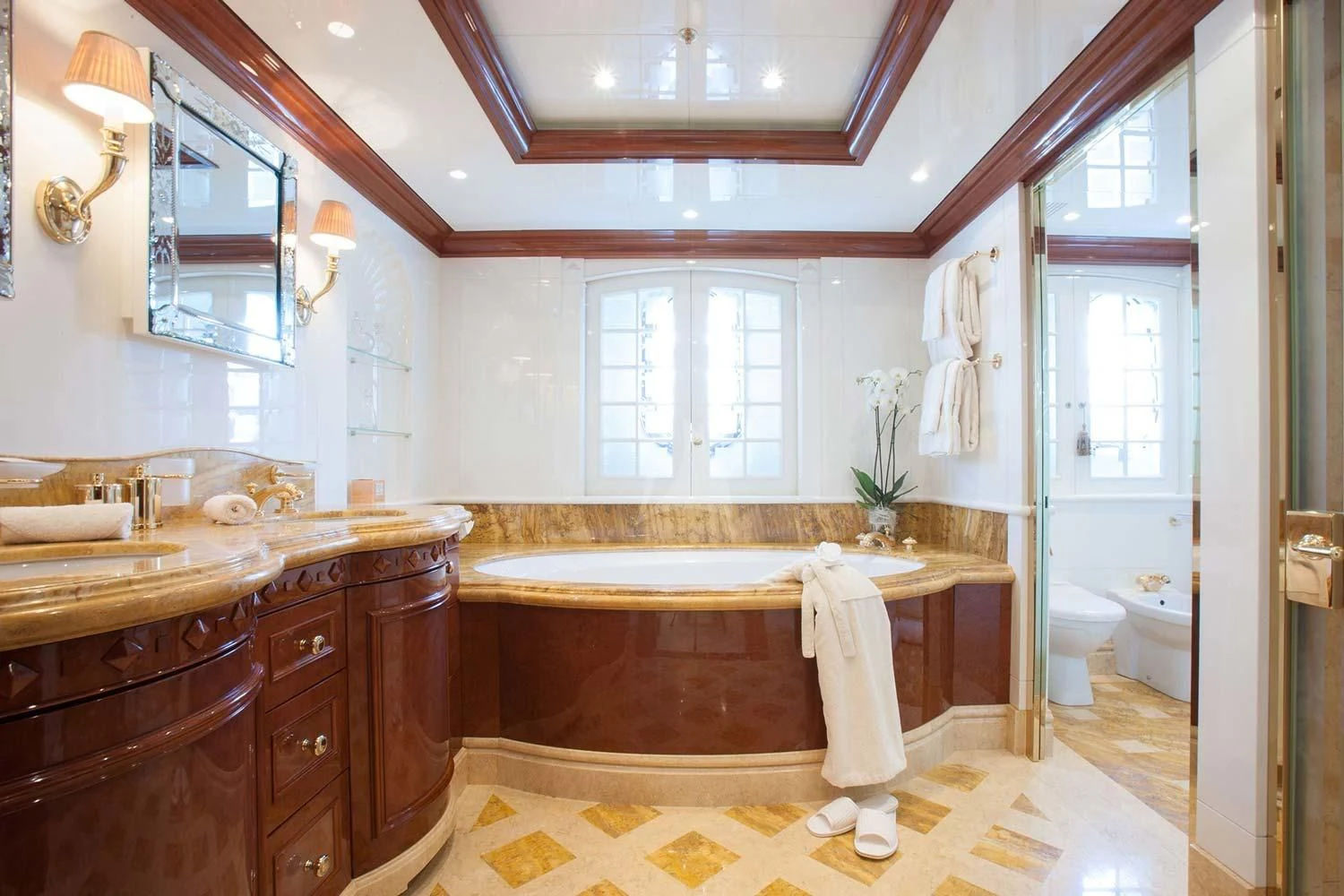 a bathroom with a tub sink and cabinets aboard ST DAVID Yacht for Sale