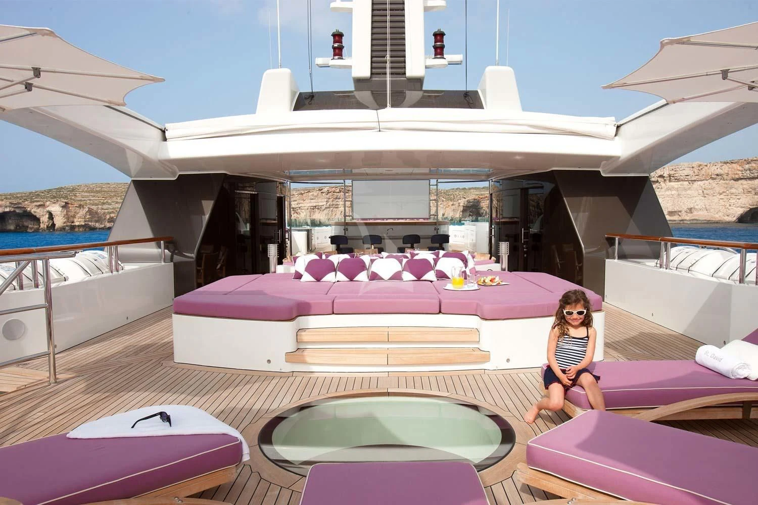 a person sitting on a lounge chair aboard ST DAVID Yacht for Sale