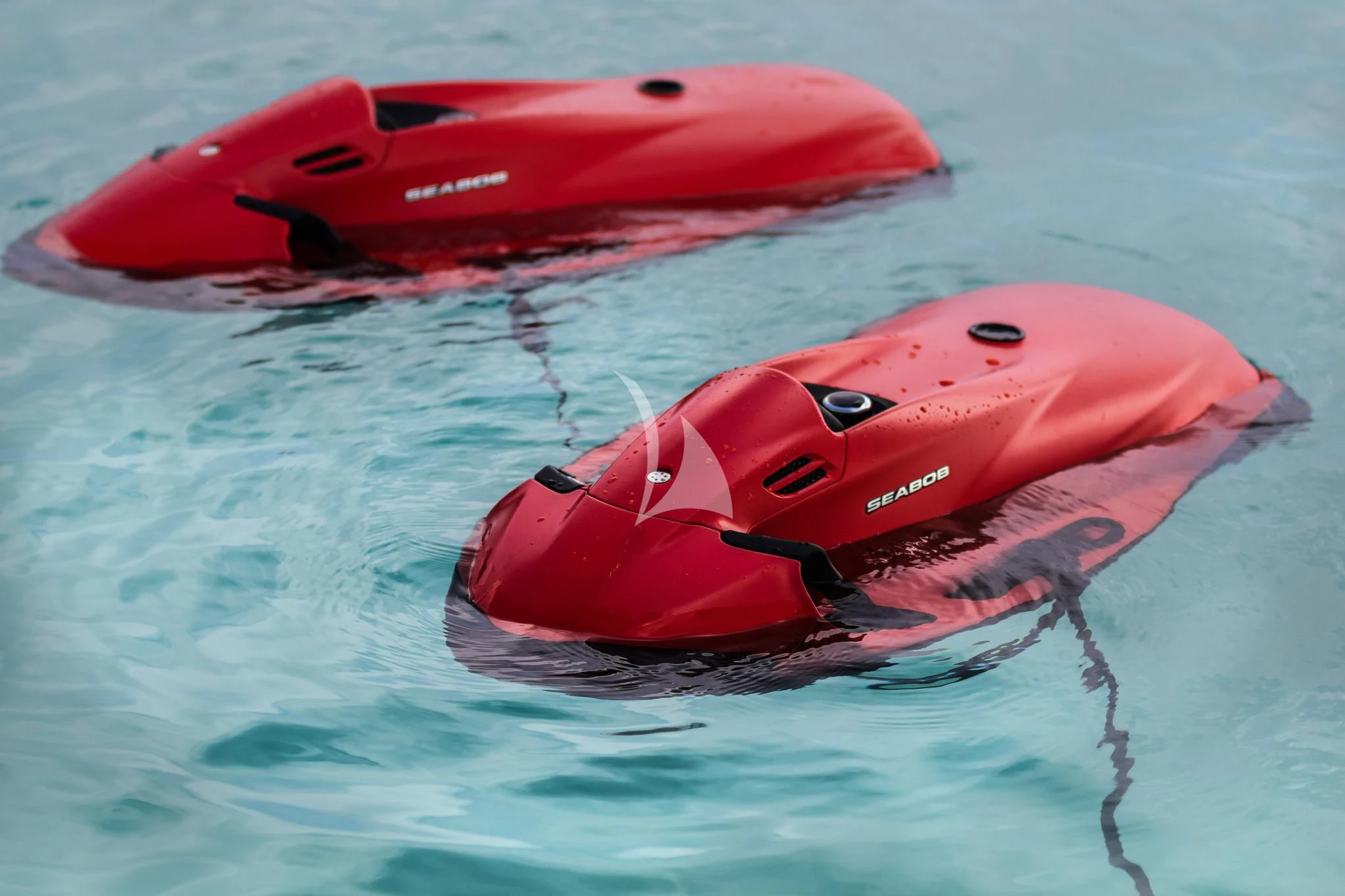 a pair of red go-karts in the water aboard ST DAVID Yacht for Sale