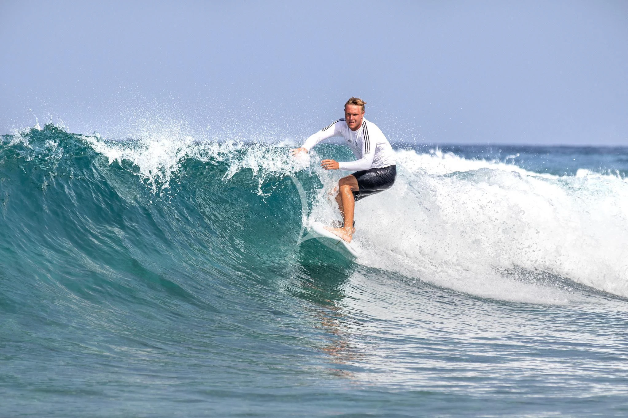 a man surfing on the waves aboard ST DAVID Yacht for Sale
