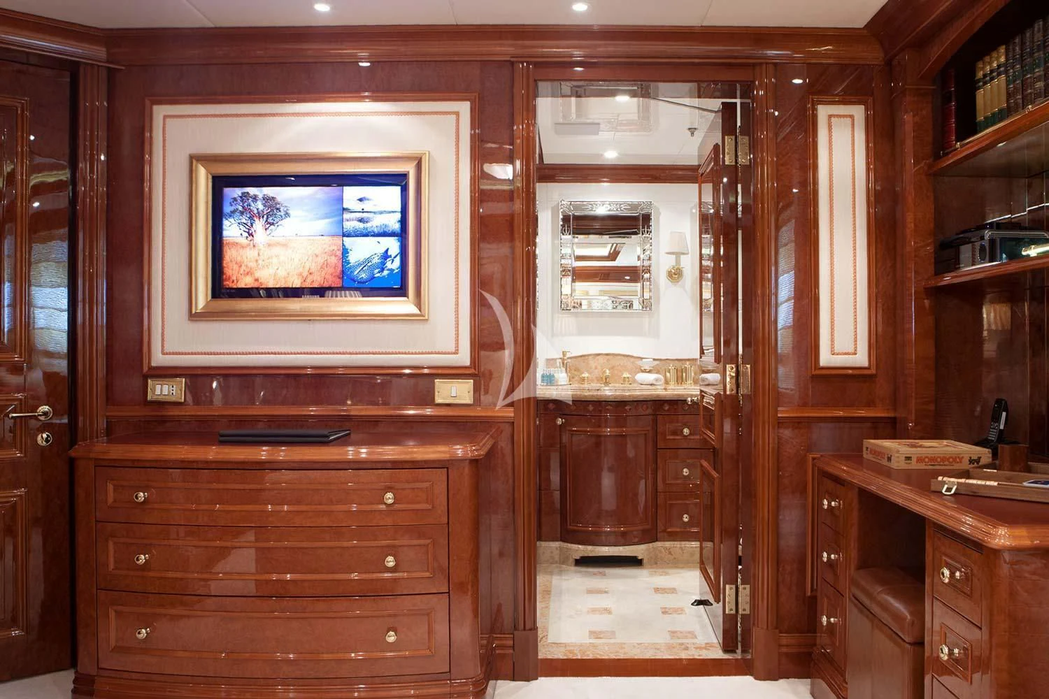 a room with a television and cabinets aboard ST DAVID Yacht for Sale
