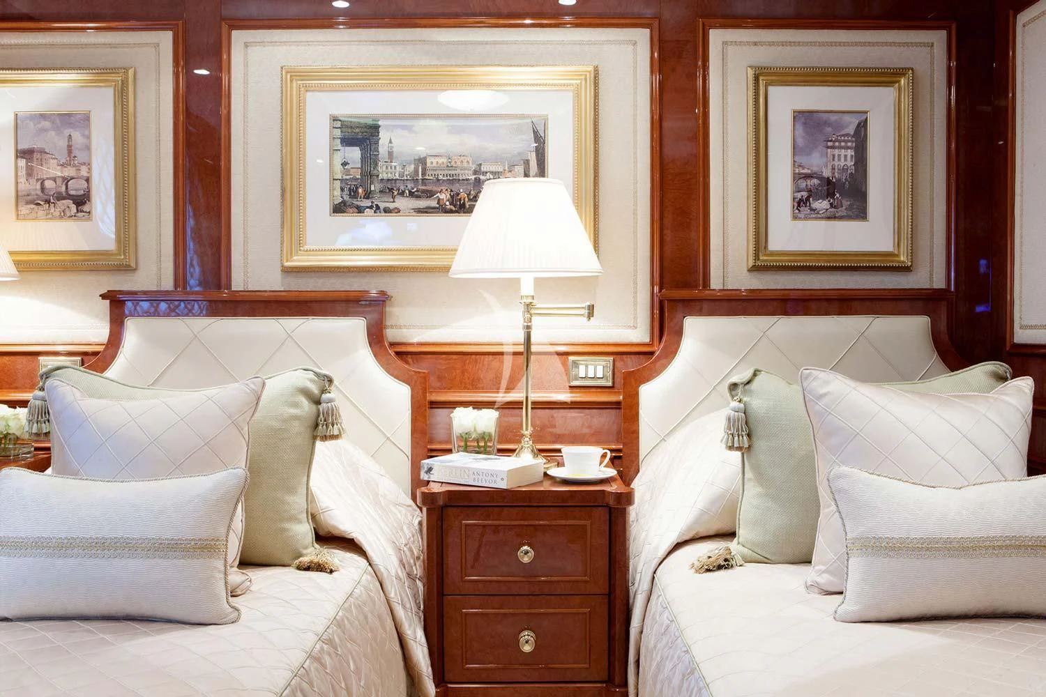 a bedroom with a bed and a lamp aboard ST DAVID Yacht for Sale
