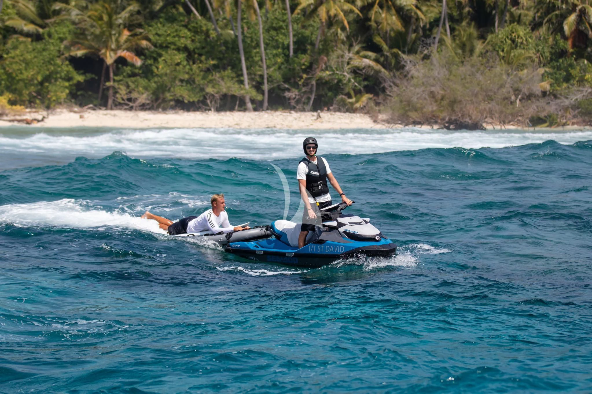 a man and a woman on a jet ski in the water aboard ST DAVID Yacht for Sale