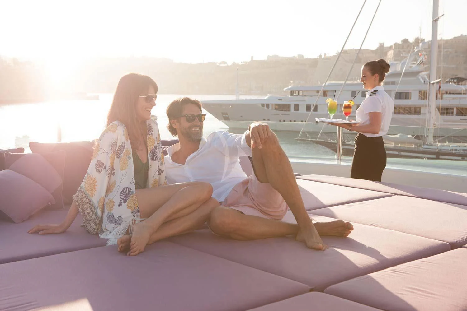 a man and woman sitting on a boat aboard ST DAVID Yacht for Sale