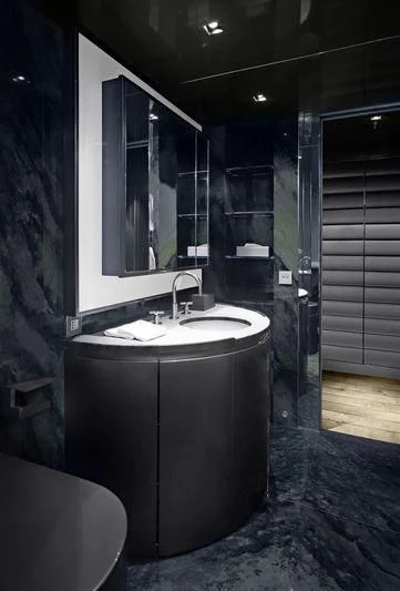 a bathroom with a sink and a mirror aboard MAIN Yacht for Sale