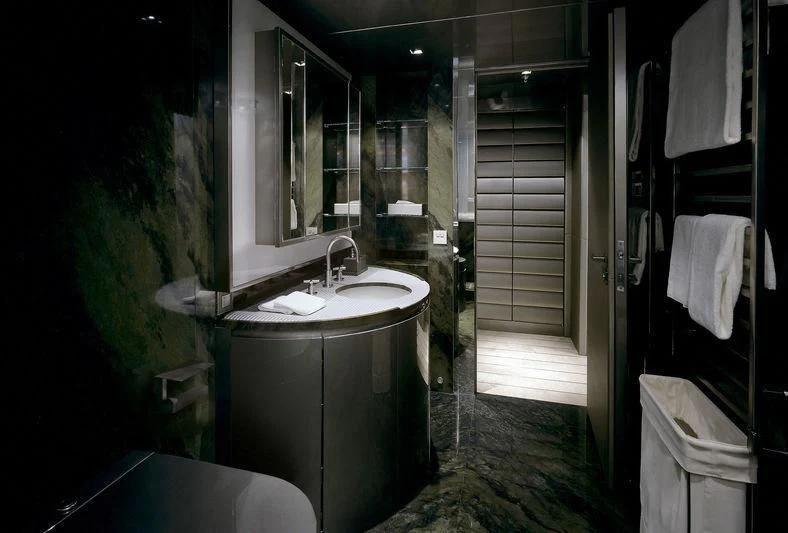 a bathroom with a sink and a mirror aboard MAIN Yacht for Sale