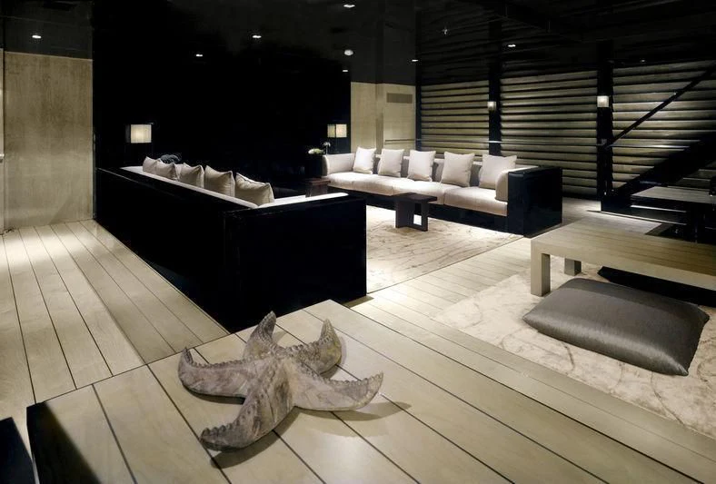 a large room with a couch and a table aboard MAIN Yacht for Sale