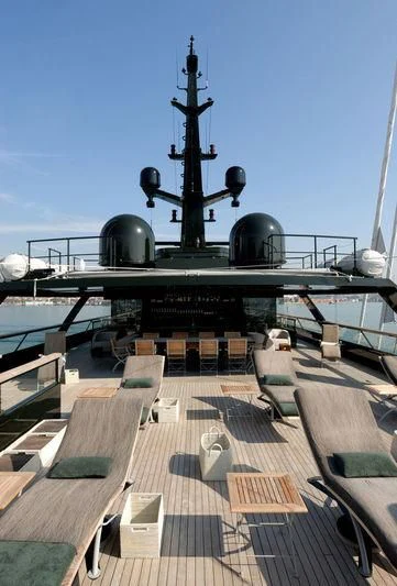 a military ship with a large gun aboard MAIN Yacht for Sale