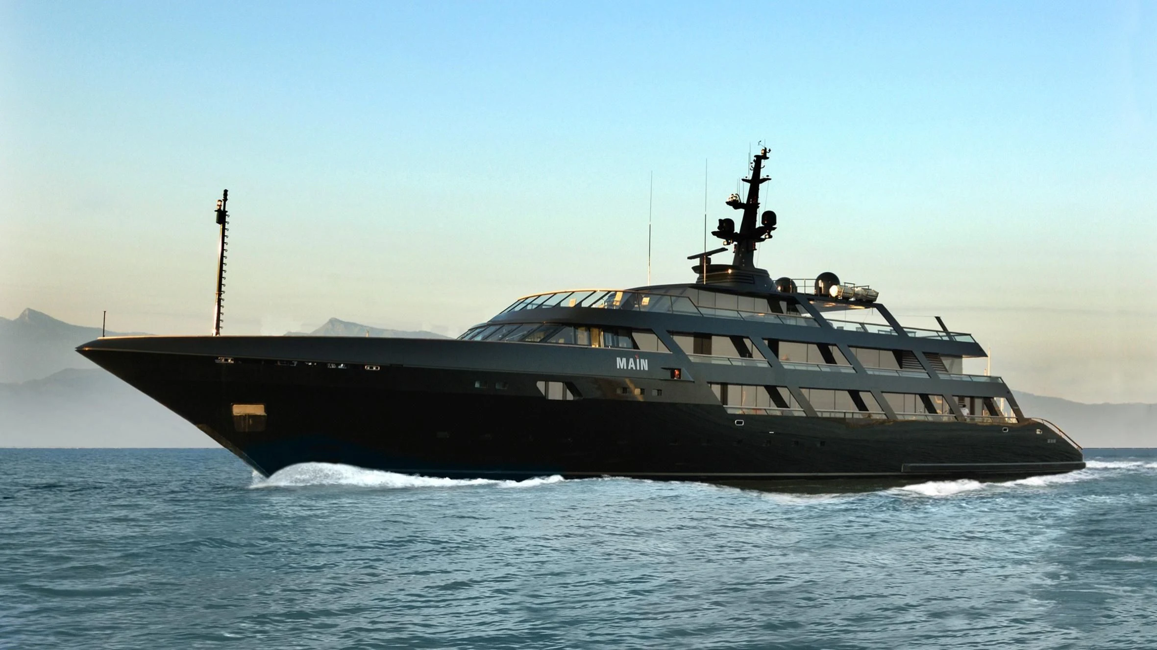 a large ship on the water aboard MAIN Yacht for Sale