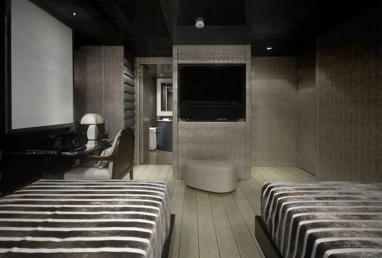 a room with a tv and a bed aboard MAIN Yacht for Sale