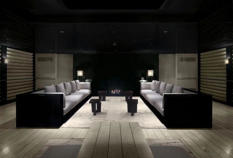 a large room with a couch and a table aboard MAIN Yacht for Sale