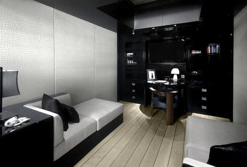 a living room with a couch and a tv aboard MAIN Yacht for Sale