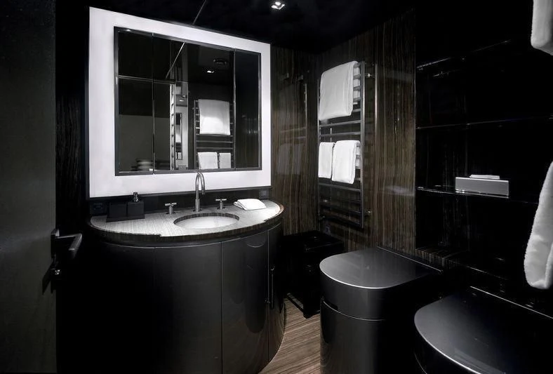 a bathroom with a sink and a mirror aboard MAIN Yacht for Sale