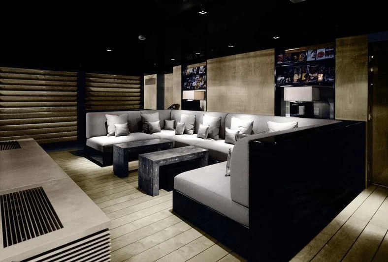 a room with a couch and a table aboard MAIN Yacht for Sale