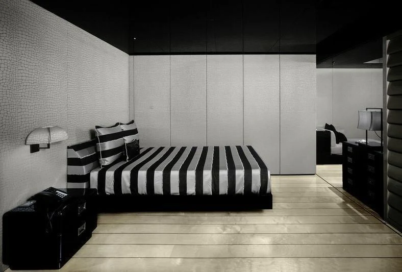 a black and white photo of a bedroom aboard MAIN Yacht for Sale