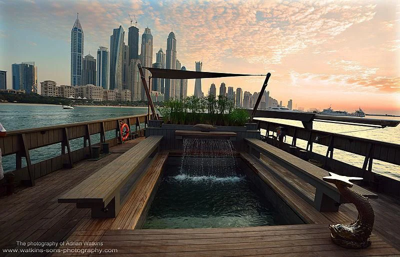 a wooden bridge over water aboard MOJO Yacht for Sale