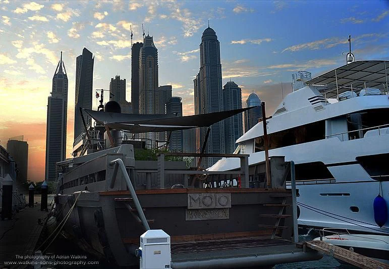 a boat docked at a dock aboard MOJO Yacht for Sale