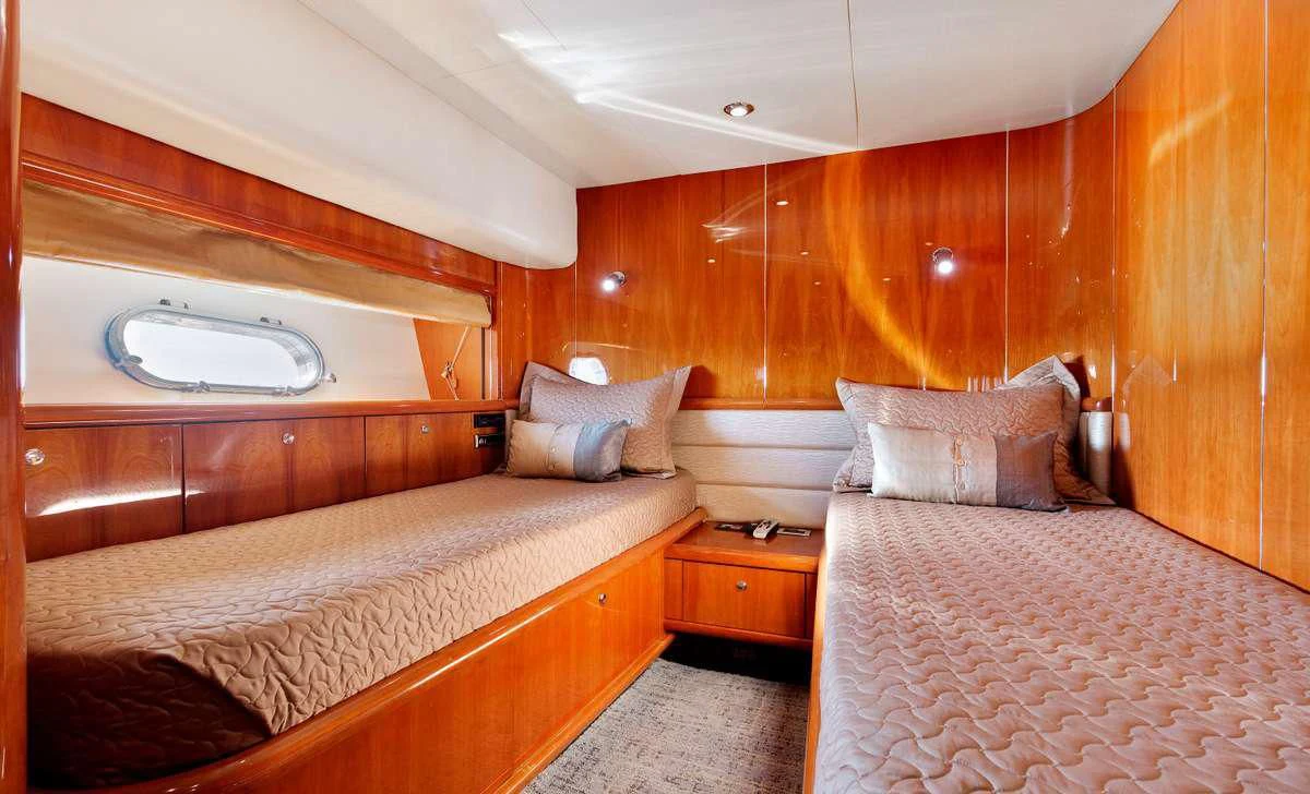 a couple of beds in a room aboard PRIVEE Yacht for Sale