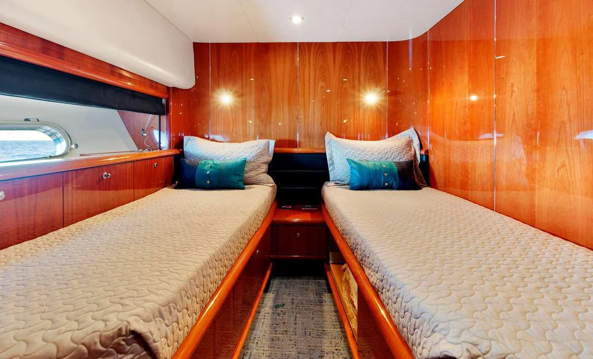 a couple of beds in a room aboard PRIVEE Yacht for Sale