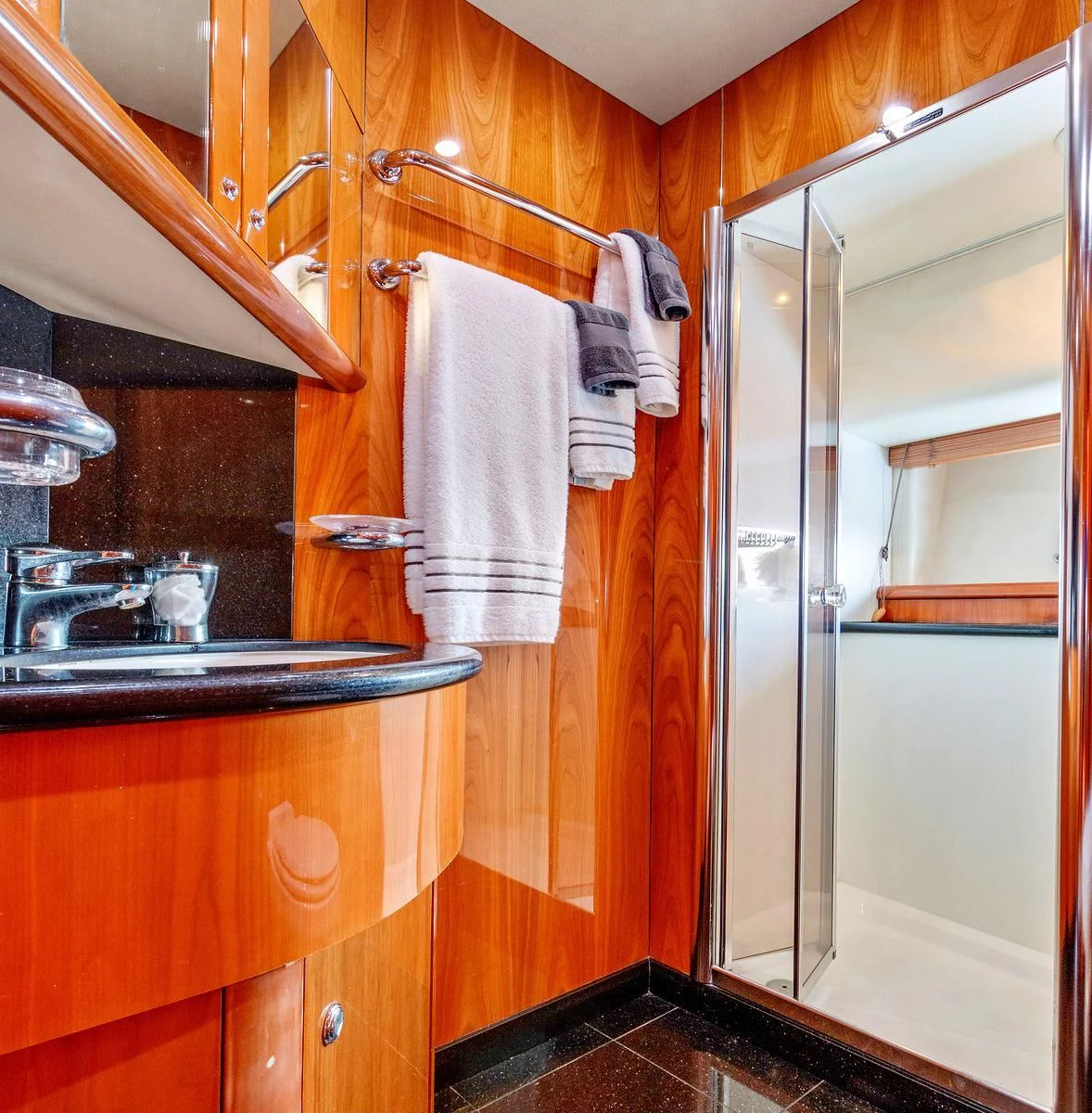 a bathroom with a shower unit and sink aboard PRIVEE Yacht for Sale