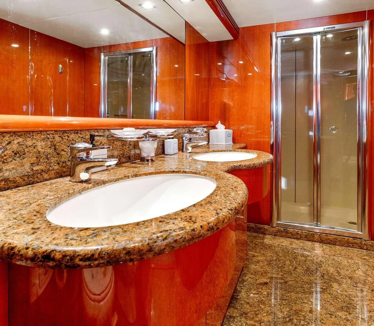 a bathroom with a sink and a mirror aboard PRIVEE Yacht for Sale